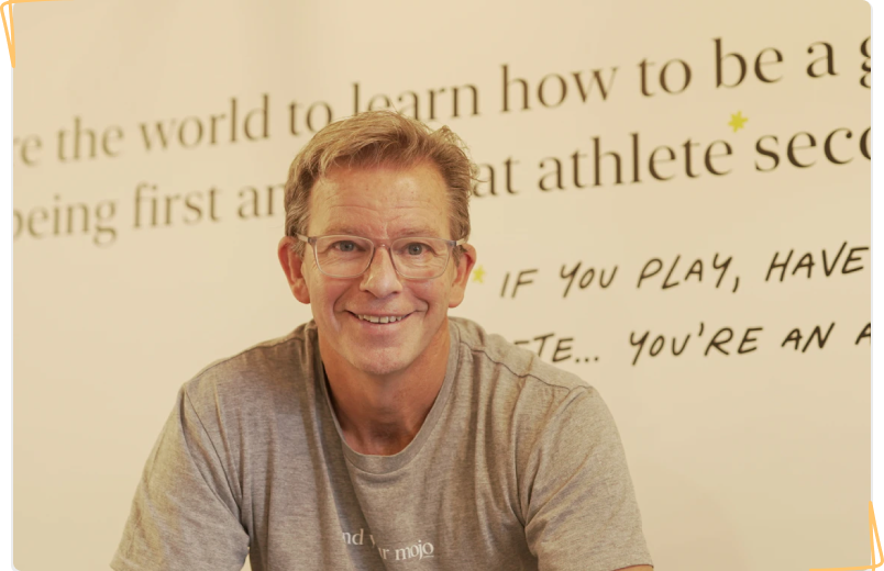 Ben Crowe at the Mojo offices with the company's vision in the background.